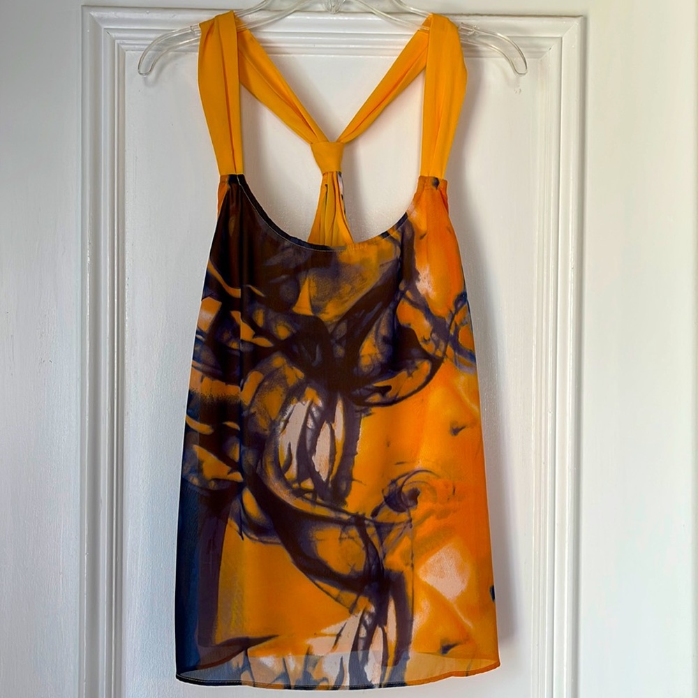 Pop in this silky Orange and Navy Top!